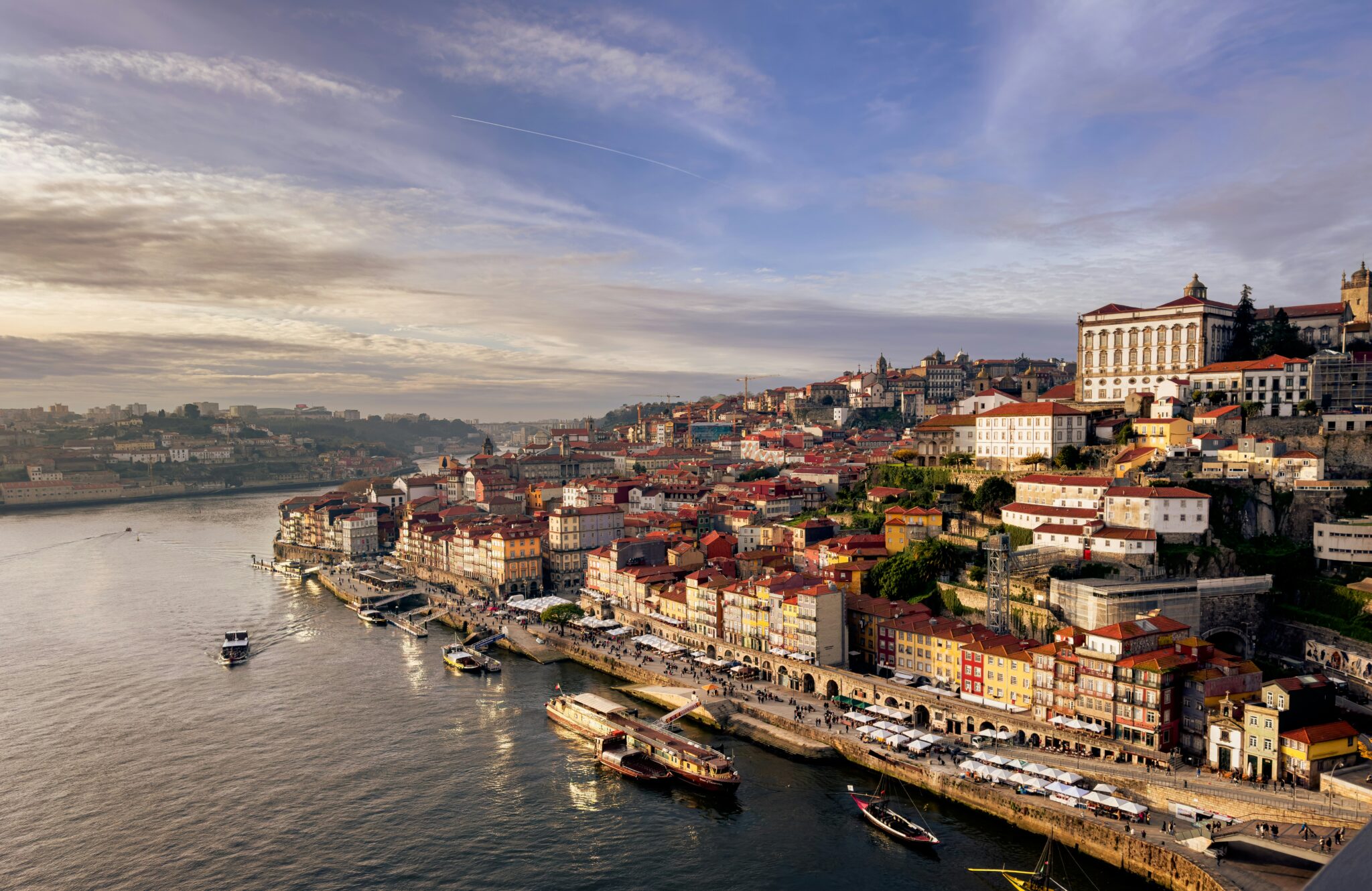 Ribeira waterfront and the Douro River in Porto in warm evening light