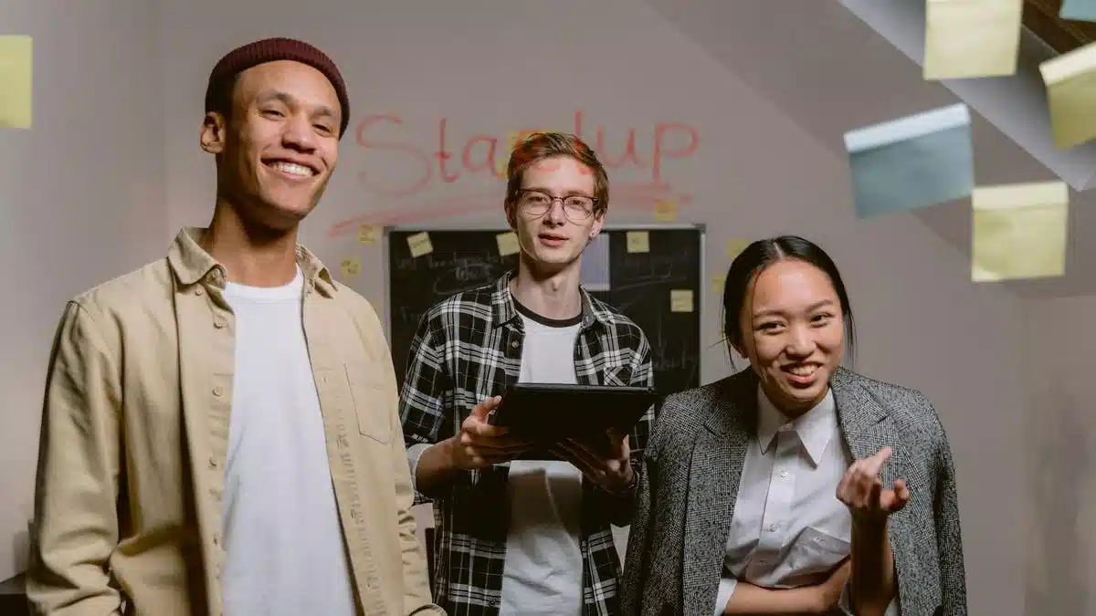 Young professionals working together in a startup office — Portugal Startup Visa incubator acceptance